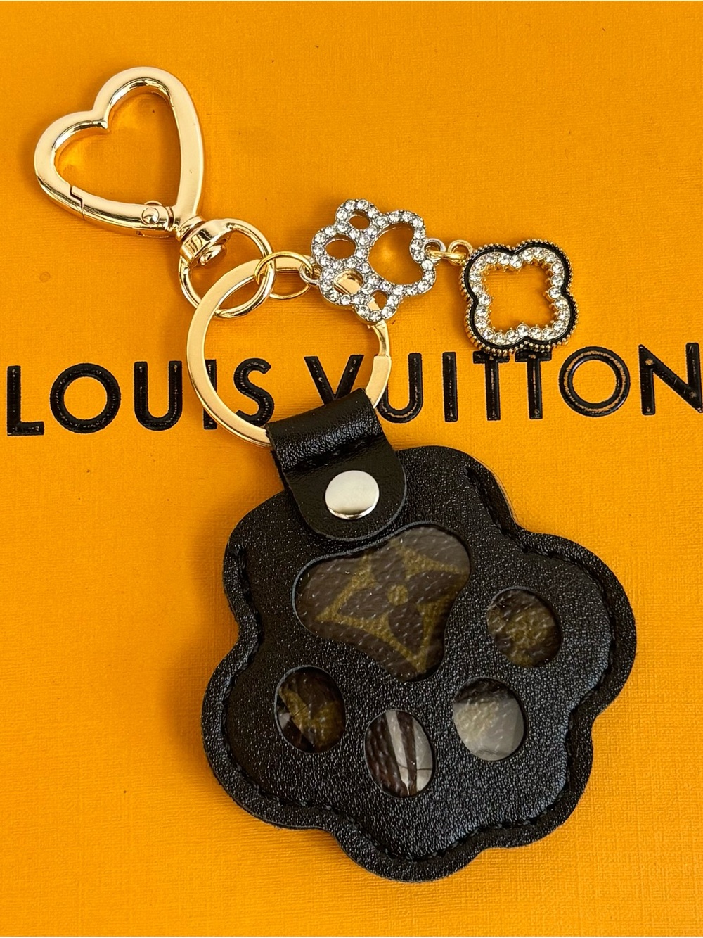 Louis Vuitton
Paw Print Bag Charm, paw rhinestone & clover.
Keychain,Upcycled